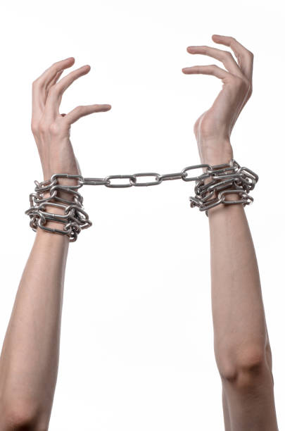 istock Social theme: hands tied a metal chain on a white background 1053465914