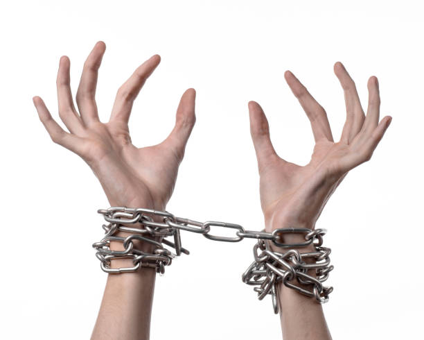 istock Social theme: hands tied a metal chain on a white background 1053466202
