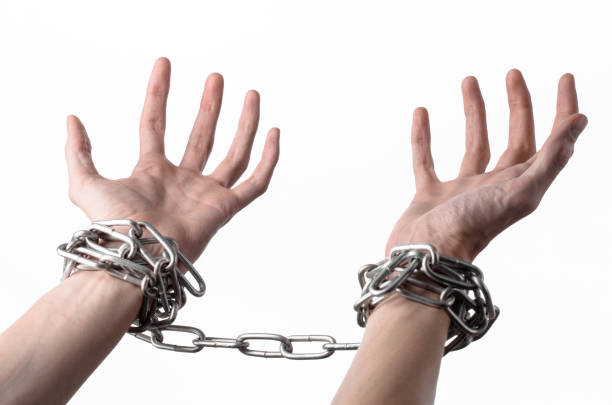istock Social theme: hands tied a metal chain on a white background 1053466484