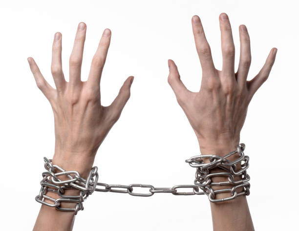 istock Social theme: hands tied a metal chain on a white background 1053466536