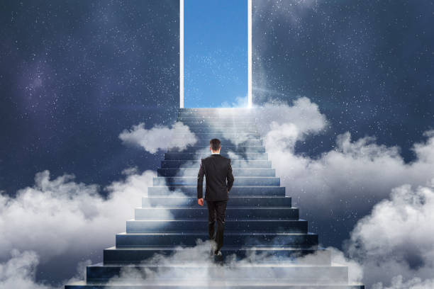 istock win concept with businessman and stairs to sky 1053469682