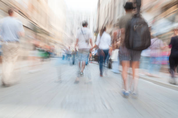 istock People crossing street, motion blur 1053470178