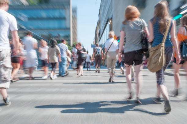 istock People crossing street, motion blur 1053470224