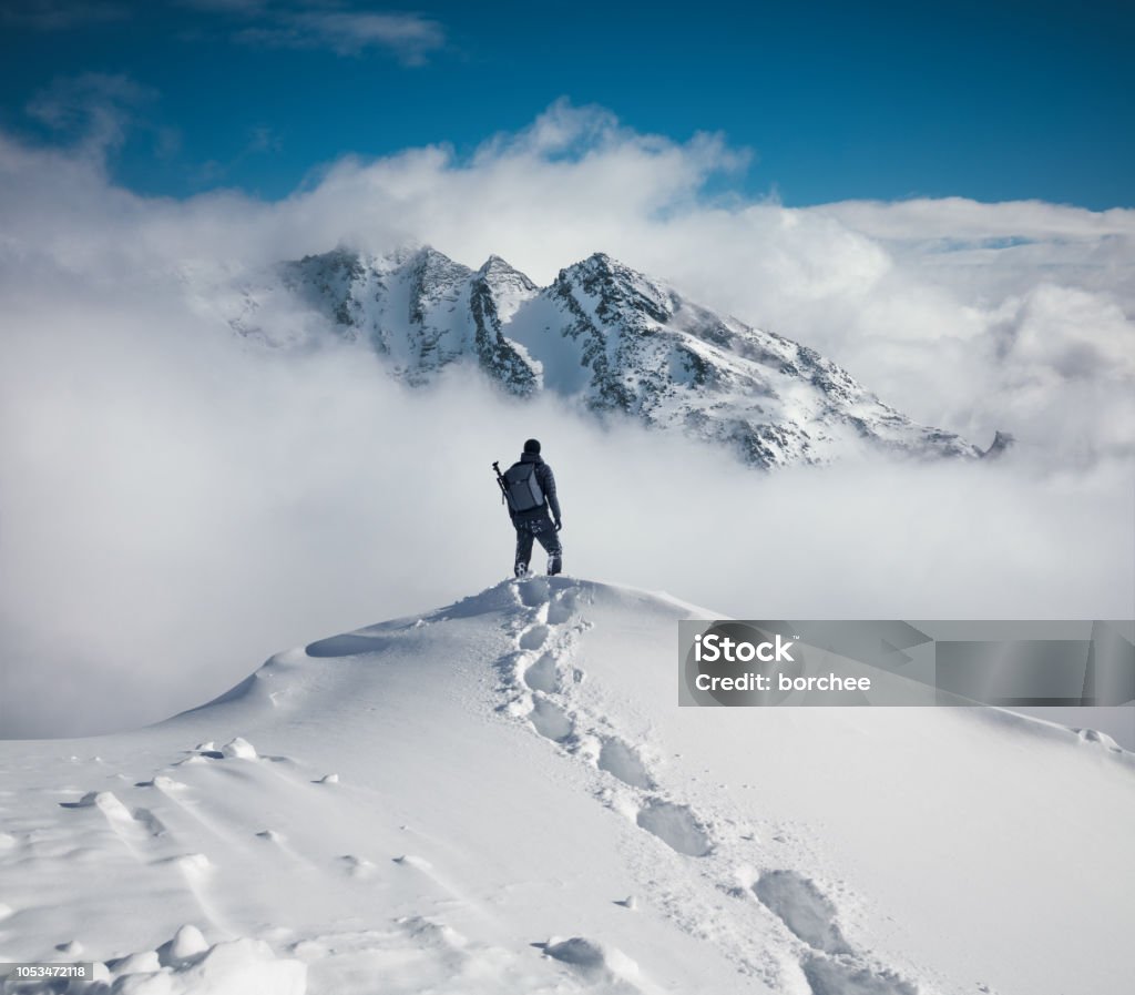 Hiking In The Mountains Mountain climbing in pure winter conditions. Mountain Stock Photo