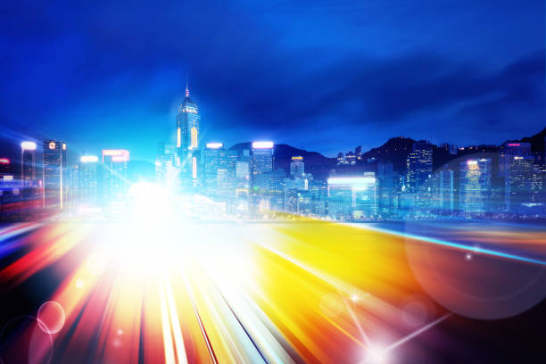 istock Abstract Light trails background with Hong Kong City scraper. double exposure 1053473562