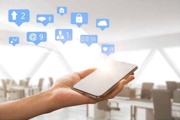istock Cellphone with social media icons 1053476064