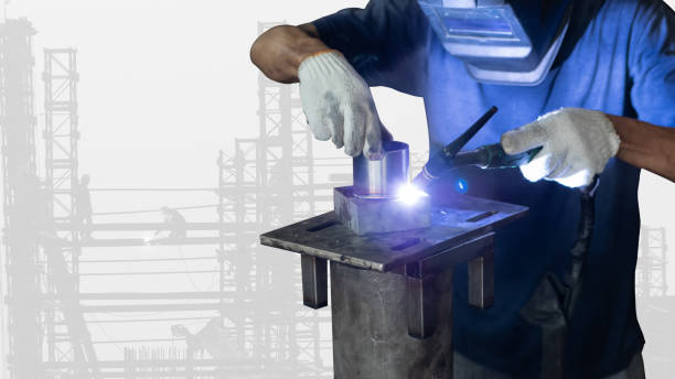 men's hands with argon welding machine.  repair pipe stainless argon welding industrial on construction background - double exposure imagens e fotografias de stock