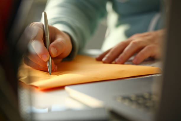 Male hand holding silver pen