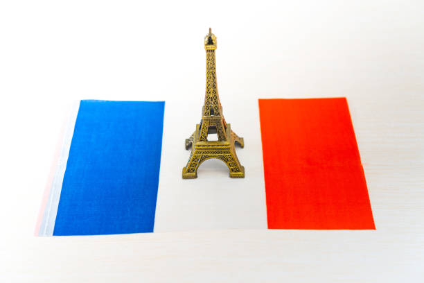 istock Metal Eiffel Tower and French flag on background 1053480546
