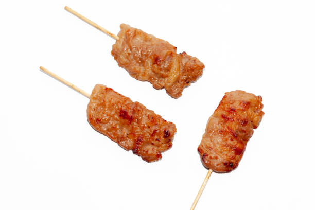 istock grilled Barbecued pork Thai style on white background 1053490108