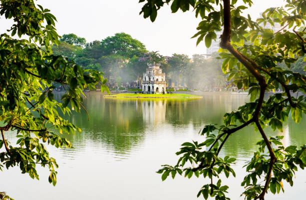 Turtle Tower in Hanoi Hoan Kiem lake in Vietnam Turtle Tower in Hanoi Hoan Kiem foggy lake in Vietnam hanoi stock pictures, royalty-free photos & images
