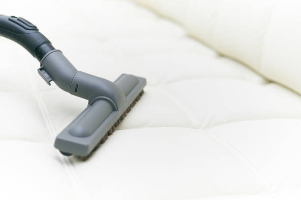 istock The vacuum cleaner brush is on the leather sofa. 1053498310