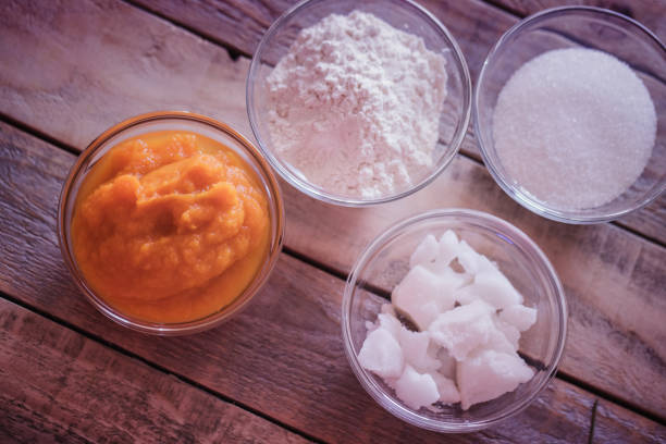 istock Pumpkin pie making - ingredients in glass bowls 1053499204