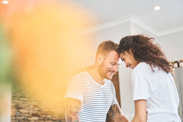 istock Happy young multi-ethnic couple with face to face 1053499570