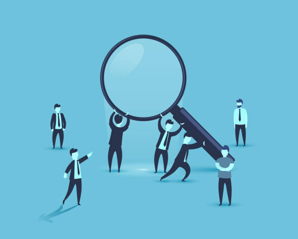 istock People are holding a magnifying glass business. 1053500104