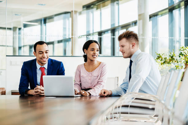 istock Meeting Between Office Employees At Conference Desk 1053501262