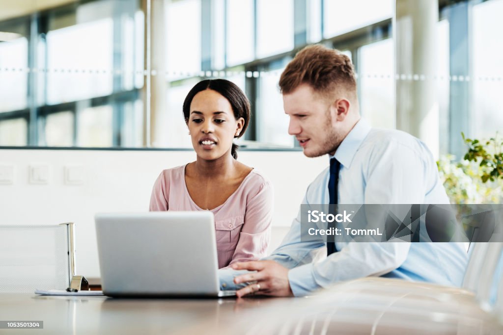 Employees Working Computer Two Office Employees Working On Computer Together Stock Photo ...