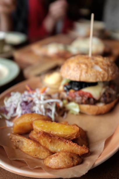 istock Fresh burger, potato slices and salad 1053501528