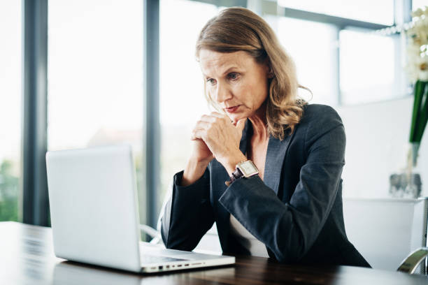 istock Business Manager Concentrating On Laptop 1053501534