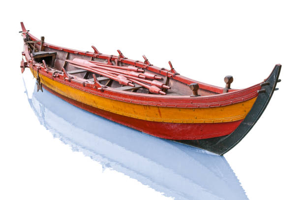 istock Old antique wooden boat isolated on white background 1053502404