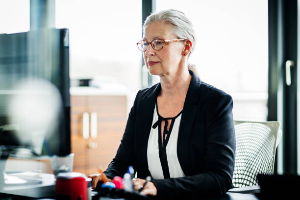 istock Mature Business Owner Working At Computer 1053502940