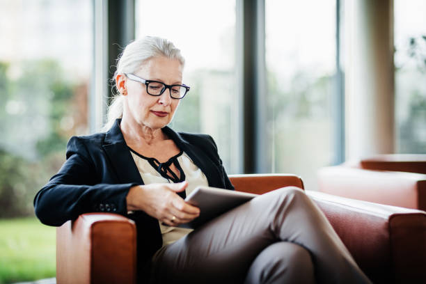 istock Mature Business Manager Looking At Tablet 1053503174