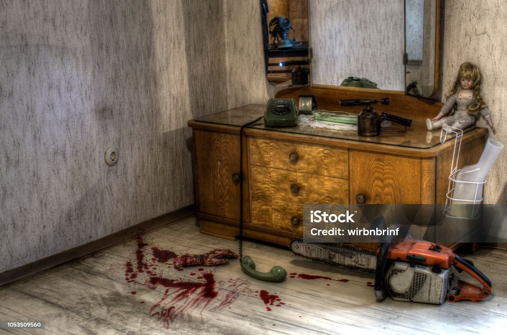 emergency call Horror emergency call scene with severed hand Chainsaw Stock Photo