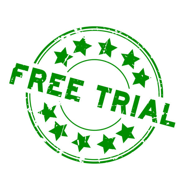 istock Grunge green free trial word with star icon round rubber seal stamp on white background 1053510394