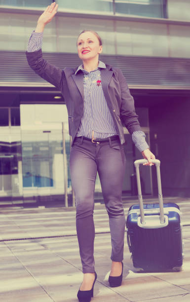 istock Adult woman worker going with baggage 1053514812