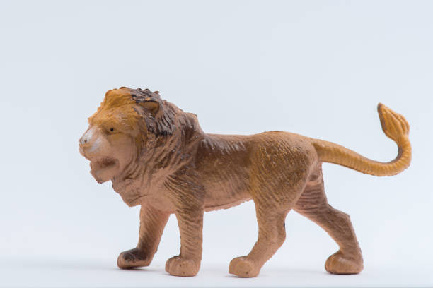 istock Lion toy model isolated on white background 1053521186