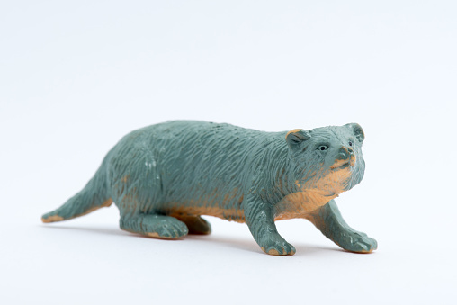 Image of River Otter toy model isolated on white background.