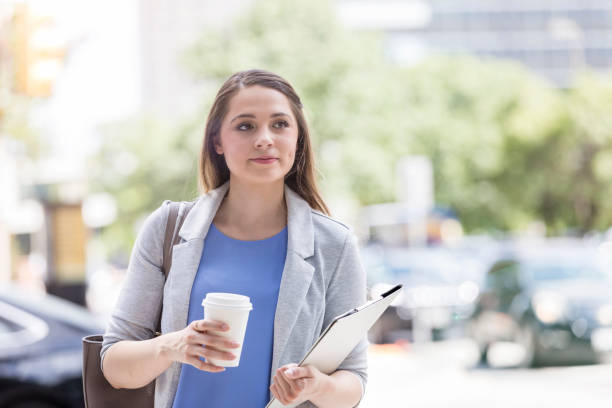 istock Young woman takes document home after work 1053526166