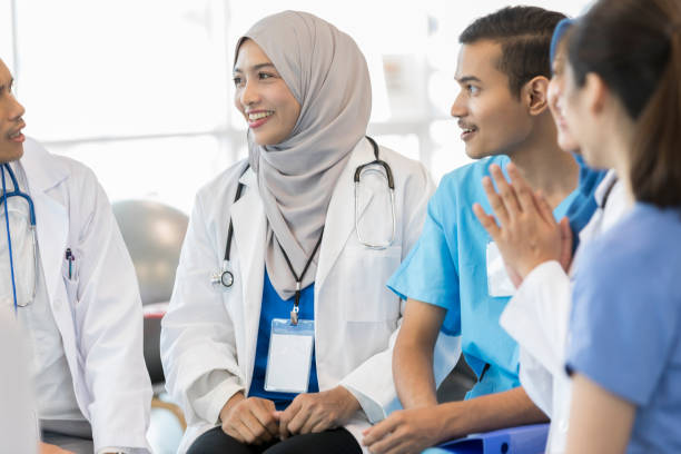 istock Medical doctors consult with surgeons on patient diagnosis 1053526348