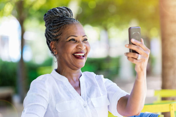 istock Senior woman takes selfie 1053526408
