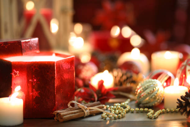 istock Christmas holiday decorations, candles, gift on table. 1053527834