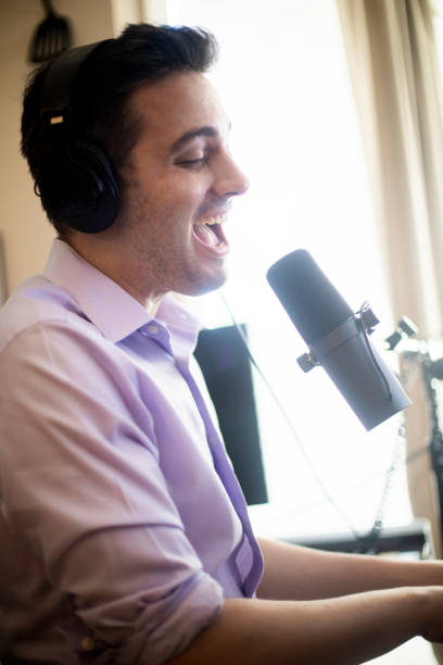 istock Piano Music Streamer Singing and Playing in Home Studio 1053529566