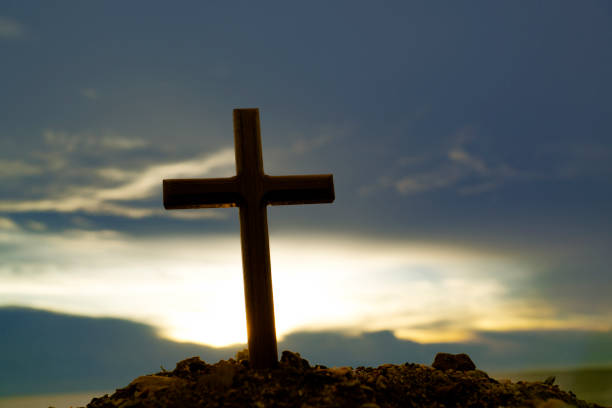 istock The cross standing on meadow 1053534296