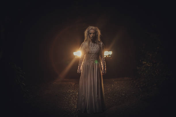 istock Halloween witch in white dress 1053536558