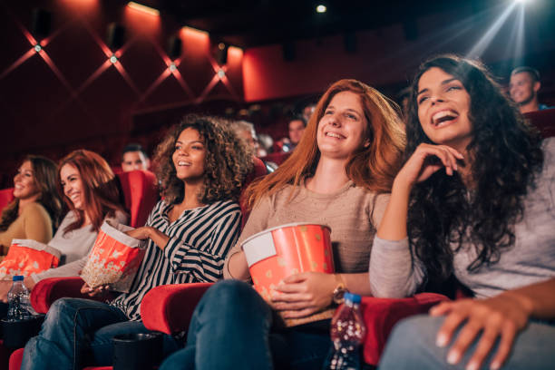 istock Joyful women at cinema together 1053537464