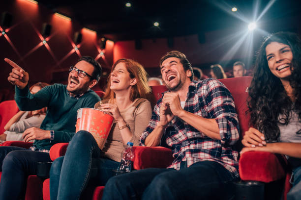 istock Smiling people at cinema 1053537602