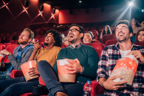 istock Smiling men at cinema 1053537886