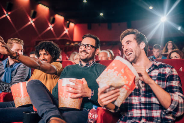 istock Men eating popcorn at cinema 1053537976