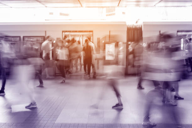 istock Motion blur people walking in train station 1053539050