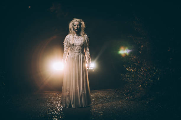 istock Scary witch in white dress 1053541032