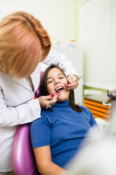 istock Girl at dentist treatment 1053541422