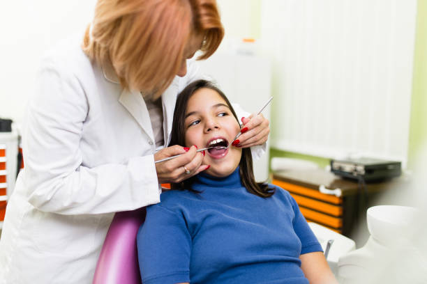 istock Girl at dentist treatment 1053541504