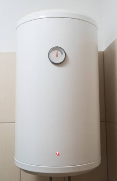 istock Modern electric water boiler on the wall. 1053541606