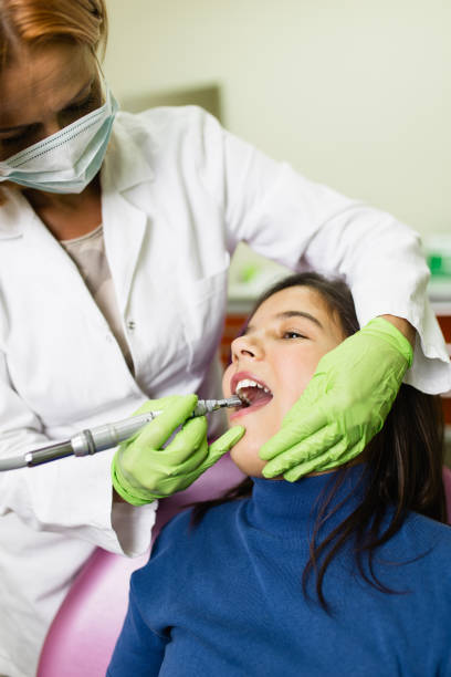 istock Girl at dentist treatment 1053541834