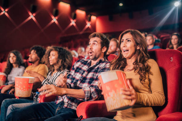 istock People watching a movie in shock 1053544248