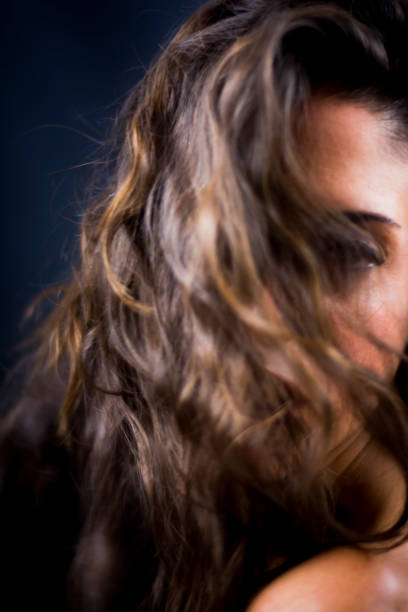 istock Beautiful woman on black background 1053546100